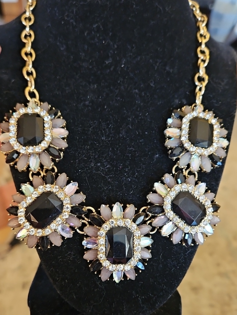 CARA Elegant Gold-Tone Statement Necklace with Black and Opal-Like Stones